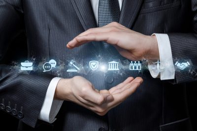 Legal protection concept. Hands of lawyer protect legal icons.